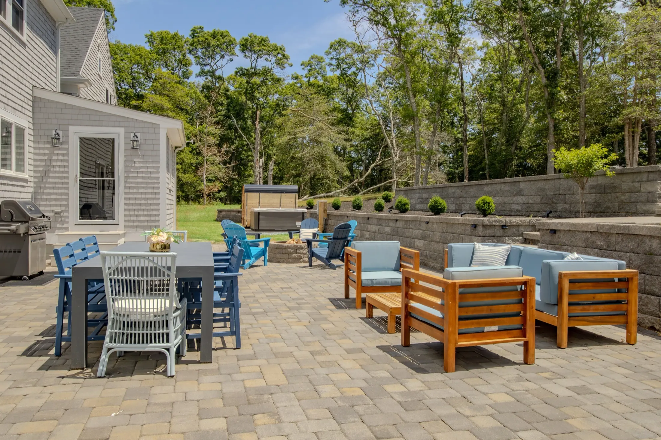 Outdoor dining on the back patio with the house behind.